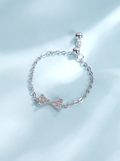 Bow open chain ring with stretchable tail ring